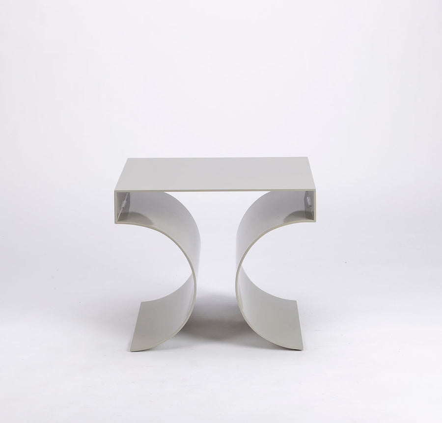 Kinkou Far East accent designer table done in silver metal with contemporary artful design. Front view. 