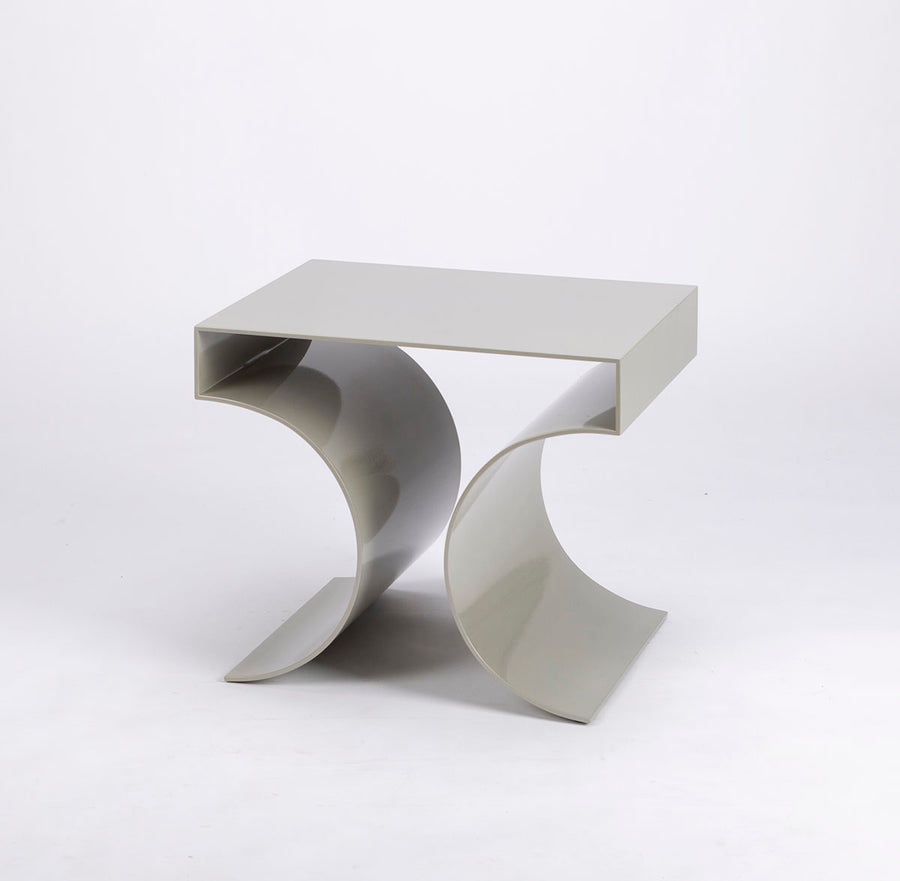Kinkou Far East accent designer table done in silver metal with contemporary artful design. Front and side  view.