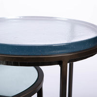 Carolina Nesting two side tables with glass top and hand forged steel. Closed up view of the top of the large table.