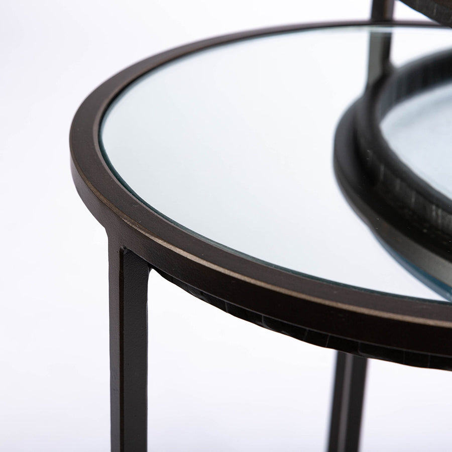 Carolina Nesting two side tables with glass top and hand forged steel. Closed up view of the top of the small table.