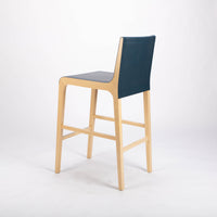 Tosca Barstool with blue leather seating and solid beechwood construction. Back and side view.