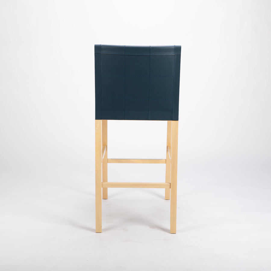 Tosca Barstool with blue leather seating and solid beechwood construction. Back view.