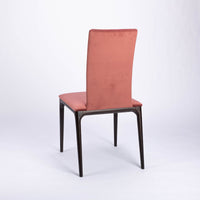 A red four seasons dining chair crafted from solid beechwood. Back and side view.