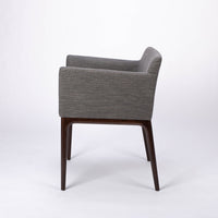 A grey four seasons dining chair crafted from solid beechwood. Side view.