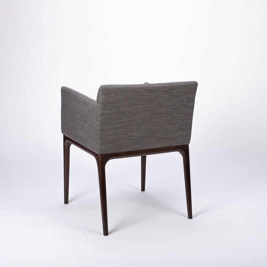 A grey four seasons dining chair crafted from solid beechwood. Back and side view.