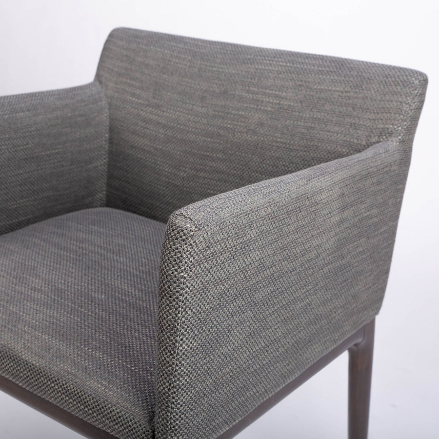 A grey four seasons dining chair crafted from solid beechwood. Closed up front view.