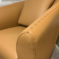Closed up look on orange leather bubble swivel chair.