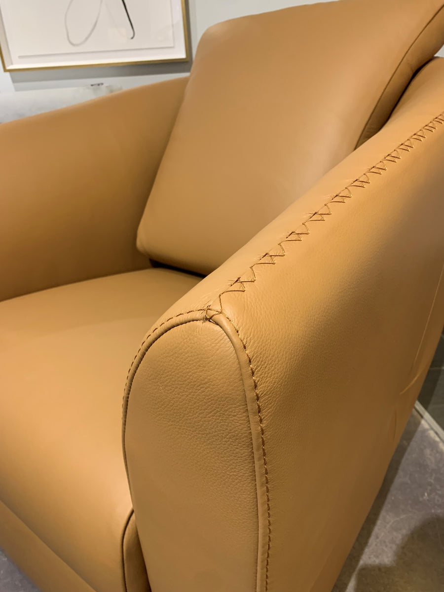 Closed up look on orange leather bubble swivel chair.