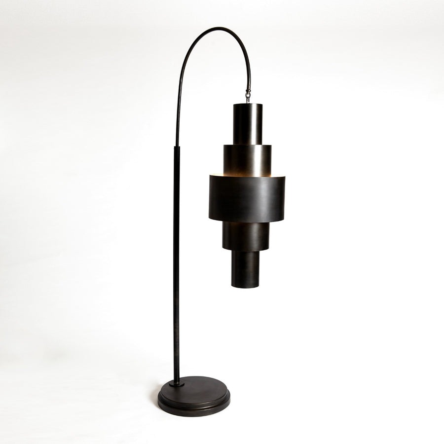 Black Babylon Floor Lamp with formed of bold concentric circles and with floor switch on cord. Closed up view on bronze finish and lamp.