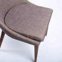 Calais Side dining chair with curved back and arms and the solid ash frame. Closed up view of seat.
