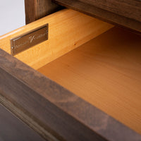 Wooden Jones Side Table with one drawer and storage space under it. Closed up view of opened drawer.