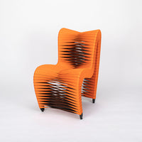 Orange and black Seat Belt dining chair with colorful seatbelt strappings.