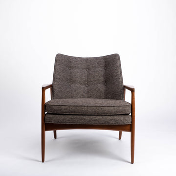 Draper Lounge Chair in midcentury modern classic design with a solid walnut external frame, a steam-bent plywood interior frame and sumptuous tailored upholstery, grey color, front view.