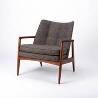 Draper Lounge Chair in midcentury modern classic design with a solid walnut external frame, a steam-bent plywood interior frame and sumptuous tailored upholstery, grey color, front and side view.