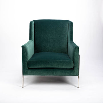 Green fabric Twiggy lounge chair with elegant leg detail in polished steel. Front view.