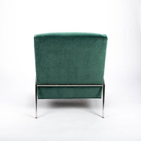 Green fabric Twiggy lounge chair with elegant leg detail in polished steel. Back view.