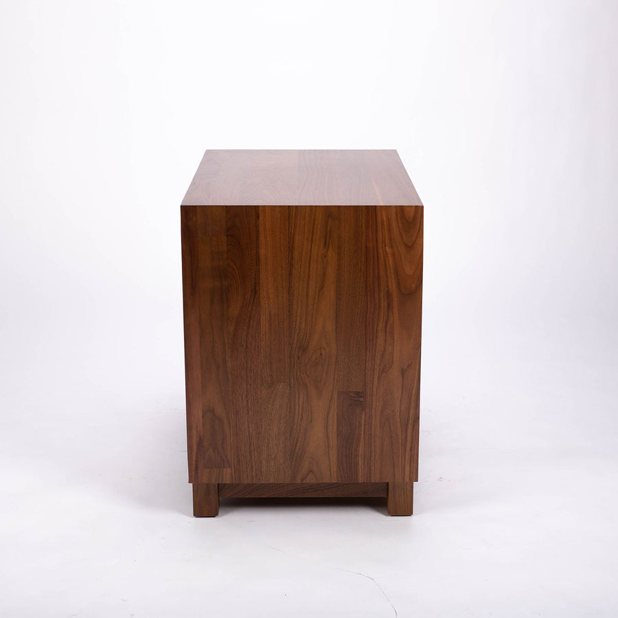 Sloane solid walnut 2 Draw Nightstand. The drawers are constructed of hardwood, dovetailed sides and bottoms and finished in the Green Guard certified finish, side view.