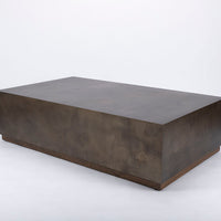 Brown Cabo Cocktail Table block shaped in an abstract metal material.