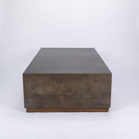 Brown Cabo Cocktail Table block shaped in an abstract metal material.