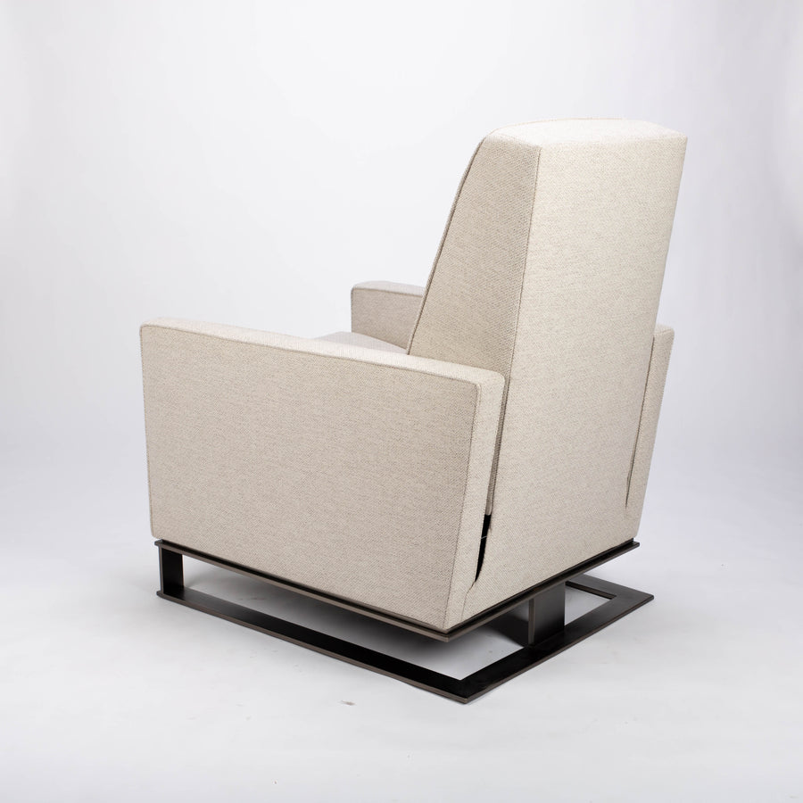 A white fabric Tate recliner lounge chair with stainless steel base, side and back view.