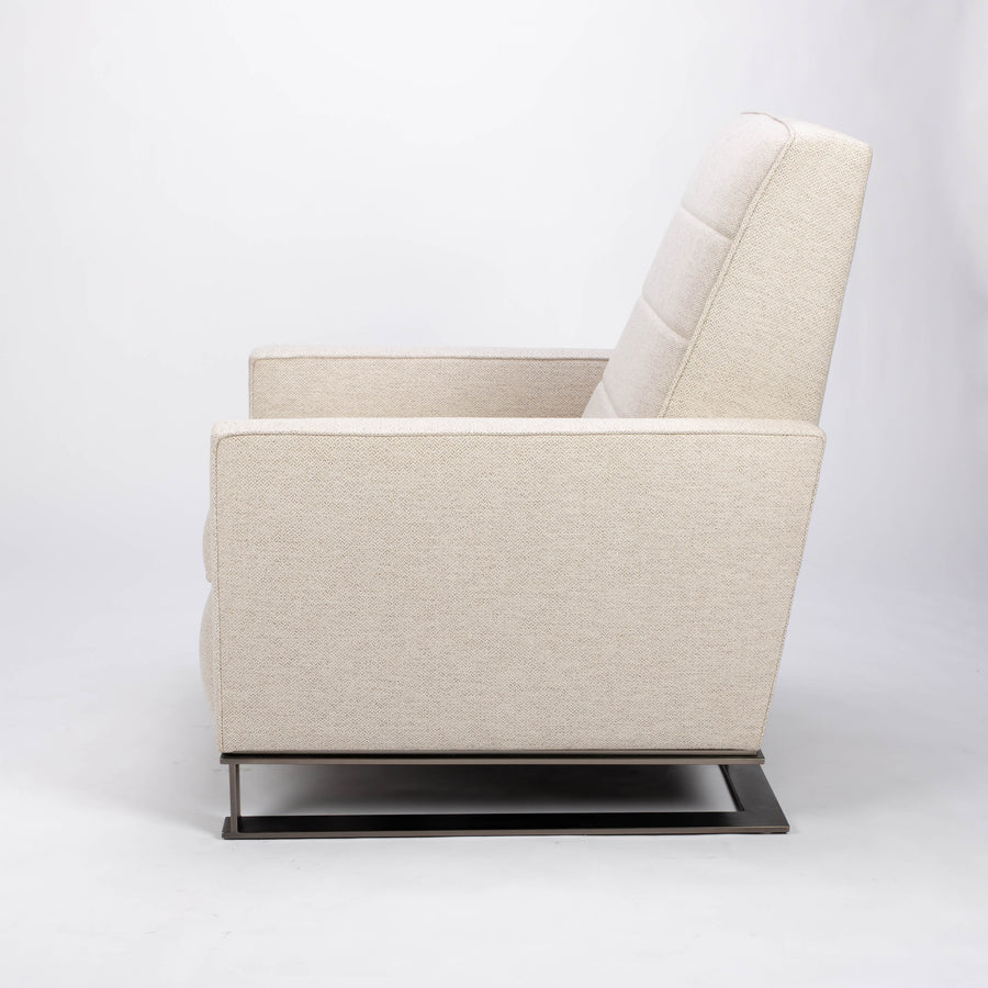 A white fabric Tate recliner lounge chair with stainless steel base, side view.