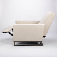 A white fabric Tate recliner lounge chair with stainless steel base, side view, reclined.