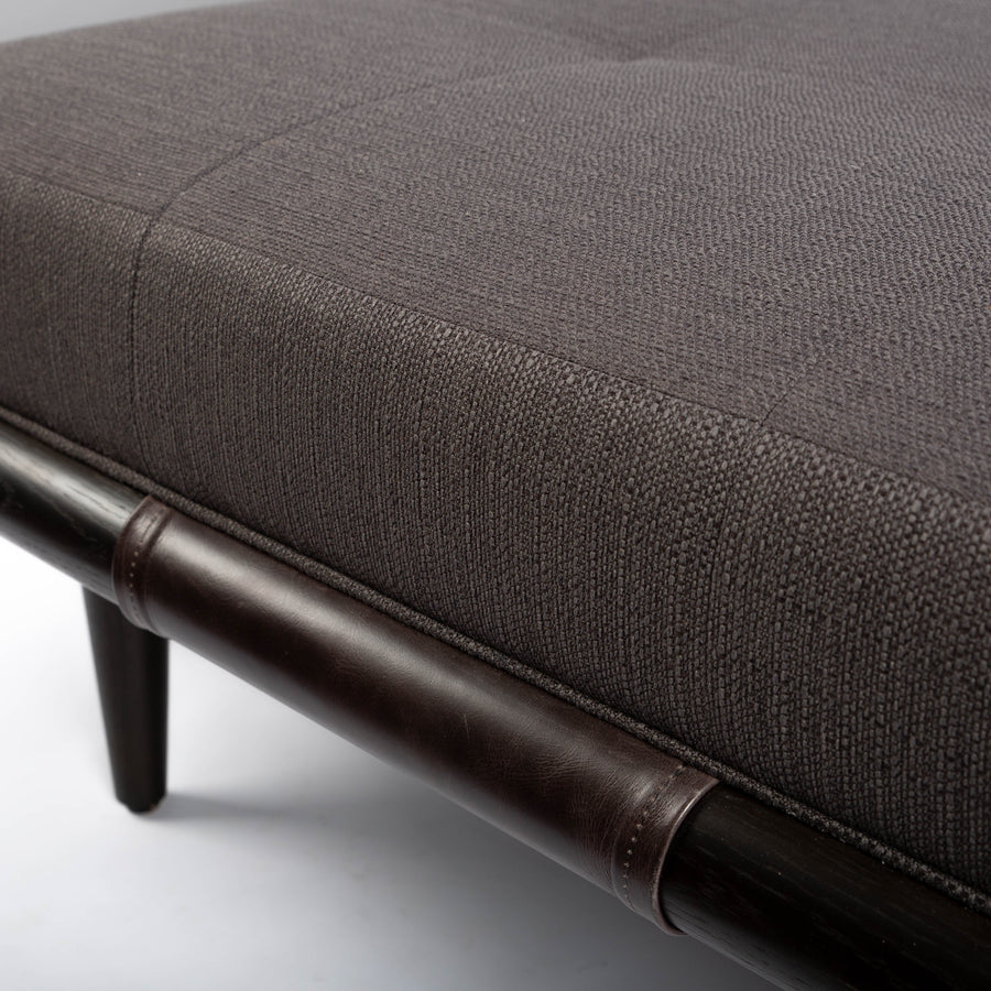 Chatfield Ottoman in Tupelo graphite with a wood base. Closed up view.