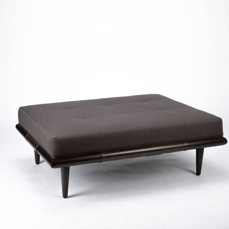 Chatfield Ottoman in Tupelo graphite with a wood base. Front and side view.