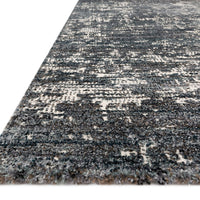 Augustus Denim Area Rug of polypropylene and polyester presents abstract display of sloping banks amidst earthy swaths of color.