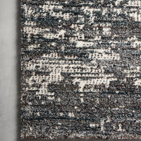 Augustus Denim Area Rug of polypropylene and polyester presents abstract display of sloping banks amidst earthy swaths of color.