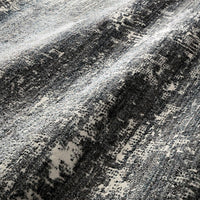 Augustus Denim Area Rug of polypropylene and polyester presents abstract display of sloping banks amidst earthy swaths of color.