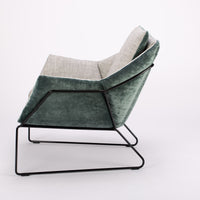 A green and white New York Poltrona lounge Chair with frame in iron rod. Side view.
