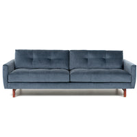 Blue two seat Carmet sofa by American Leather with modernist track arms that taper in from the top of the sofa to the bottom.. Front view.