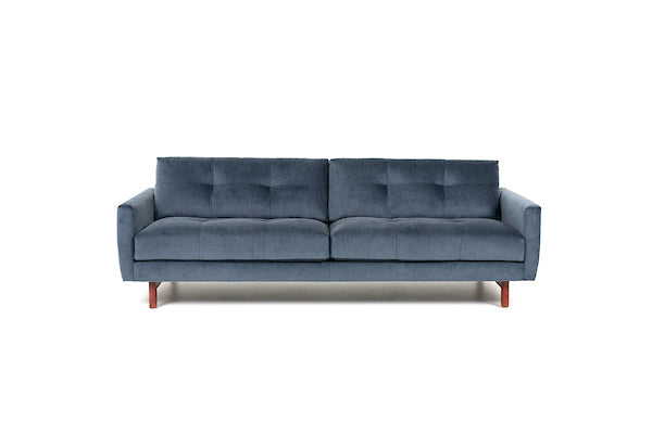 Blue two seat Carmet sofa by American Leather with modernist track arms that taper in from the top of the sofa to the bottom.. Front view.