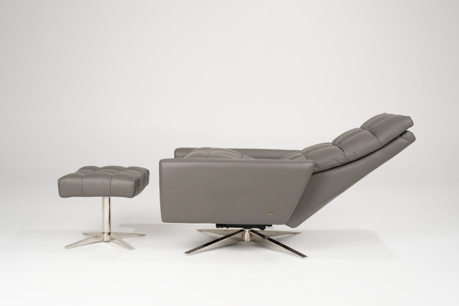 A reclined grey leather Huron recliner and lounge chair with natural walnut four-star base and ottoman.