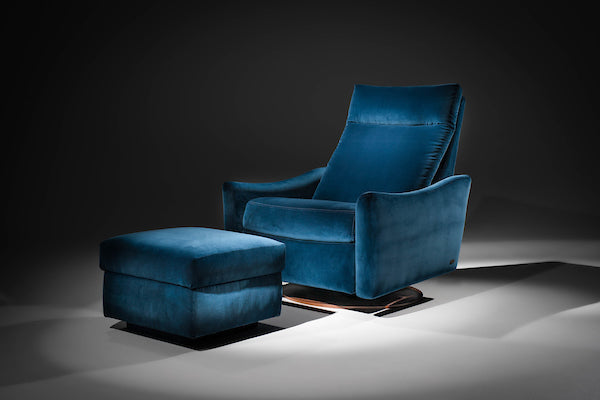 A blue leather Ontario modern rocking recliner chair and ottoman.