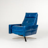 A blue leather recliner chair with four star base.