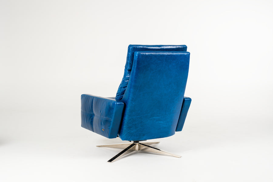 A reclined blue leather recliner chair with four star base, back view.