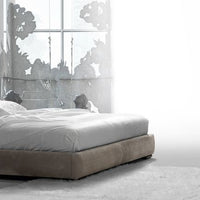 Wafer Nite Modern leather-upholstered bed with a high backrest and horizontal topstitched strips, side view.