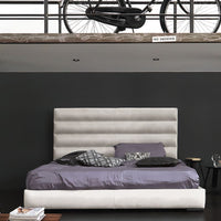 Wafer Nite Modern leather-upholstered bed with a high backrest and horizontal topstitched strips, front view.