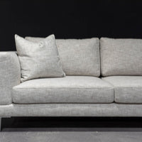 Dania three seat sofa with slender tapered aluminum legs and a long low profile, high end seating comfort and expert tailoring.