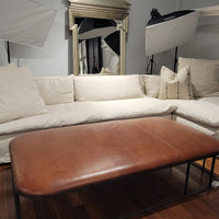 White Donato Sectional with inviting design and easy-care slipcover.