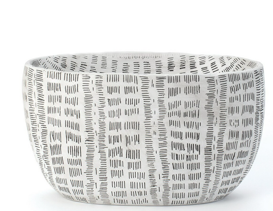 Handmade Frequency Oval Bowl that features an African mud-cloth-inspired original painting by the designers that is carved into the ceramic forms.