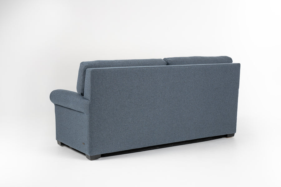 American Leather Gibbs Two Seat Standard (Queen) Comfort Sofa bed in indigo color with high tapered wood legs, back view.