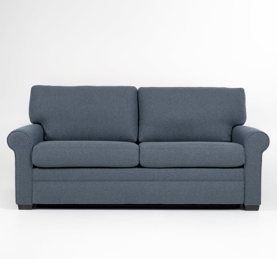 American Leather Gibbs Two Seat Standard (Queen) Comfort Sofa bed in indigo color with high tapered wood legs, front view.