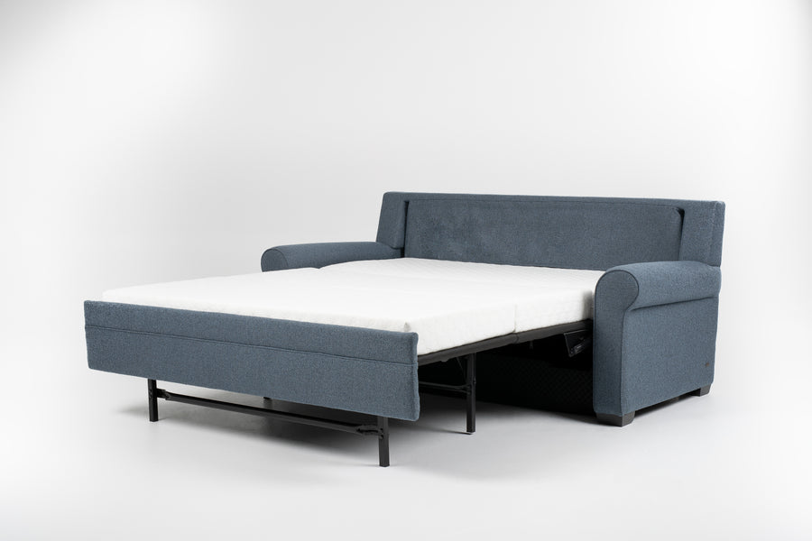 American Leather Gibbs Two Seat Standard (Queen) Comfort Sofa bed in indigo color with high tapered wood legs, front and side view, pulled-out.