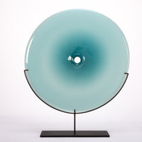 Discs of handblown Czech glass with black body and base.