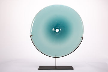 Discs of handblown Czech glass with black body and base.