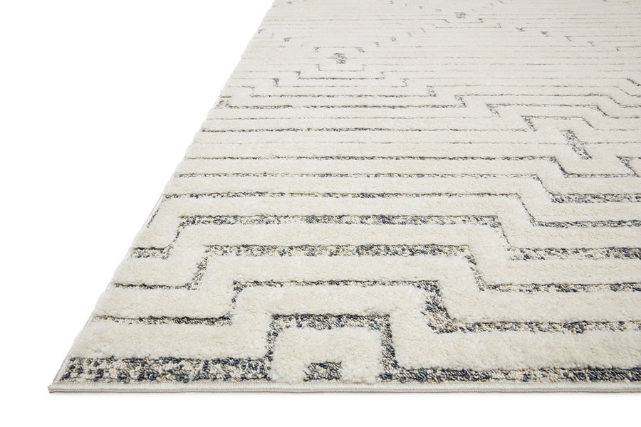 Hagen White Sky Area Rug power-loomed of 100% polypropylene pile with a tone on tone palette offset by strong, yet textural geometric patterns.