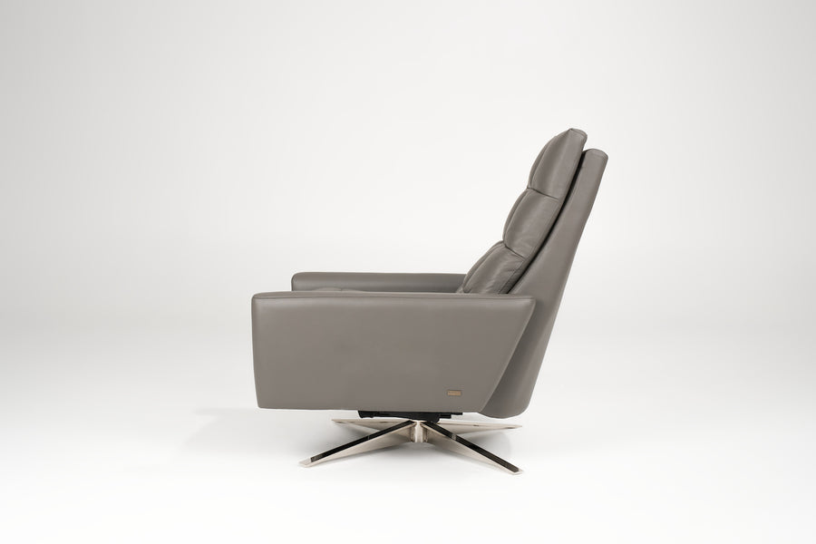 A grey leather Huron recliner and lounge chair with natural walnut four-star base, side view.